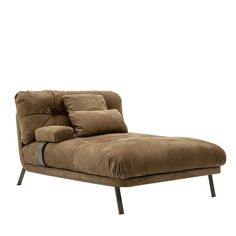 a brown chaise lounge chair with pillows on it