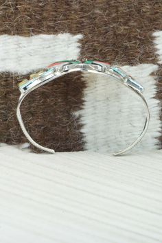 This turquoise, coral, mother of pearl, jet and sterling silver inlay butterfly bracelet was made by Zuni silversmith Tamara Pinto. The inside is stamped sterling.Size: 5 1/8" (will fit up to a 6 1/4" wrist)Gap: 1 1/8"Length: 1 1/4"Free shipping on all orders! We ship with USPS and always include tracking. All orders ship within a day of payment.Returns are accepted up to 30 days after you receive your order. Just send us a message. Our shop offers cash back or store credit. The item must be ret Butterfly Bracelet, Multi Stone, Native American Jewelry, Free Jewelry, Mother Of Pearl, Gap, Hoop Earrings, Coral, Turquoise