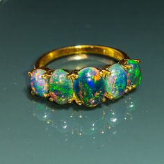 Note- The fire opals are set on a ring on a made-to-order basis, and the upgraded opals or personalized Opal up-gradation have extra charges, DM for the upgrade opal ring price. Best Quality Fire Opals Are Used In 14k Or 18K Gold. Black Ethiopian Opal Gemstone Handmade Jewelry 925 Sterling Silver Ring, Perfect Gift For Your Loved Ones. Handmade Ring, Statement Ring, Proposal Ring, Promise Ring, Wedding Ring. About Ring:- Gemstone - Natural Ethiopian Opal Metal - 925 Sterling Silver/ 14k or 18k G 14k Gold Opal Ring, Black Opal Jewelry, Black Fire Opal, Australian Black Opal, Opal Birthstone, Black Opal Ring, Opal Wedding Rings, Fire Opal Ring, Opal Ring Gold