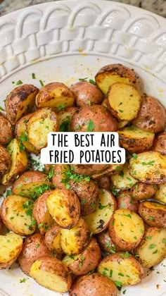 the best air fried potatoes on a white platter with parsley sprinkled