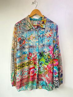 Johnny Was Floral Print Top! Has long sleeves, a classic collar, and buttons up the front. 100% rayon. Size large, please refer to measurements. In excellent condition! Approx. Measurements: Underarm to Underarm: 22" Sleeve Length: 25" Length: 29.5" Multicolor Print Long Sleeve Silk Top, Multicolor Long Sleeve Silk Shirt, Long Sleeve Multicolor Silk Shirt, Multicolor Print Long Sleeve Silk Blouse, Spring Long Sleeve Silk Shirt, Multicolor Long Sleeve Shirt With Button Closure, Silk Long Sleeve Multicolor Print Blouse, Long Sleeve Floral Print Shirt For Daywear, Multicolor Print Silk Long Sleeve Blouse