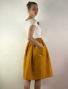 "Write the selected color in the message Handmade mustard linen midi skirt with зatch pockets on the sides, elastic waistband, perfect for casual wear and suitable for any occasion in any season Details: - 100% natural linen produced in Europe ; - medium weight (180 gram per square meter); - color: mustard, could be any from our colors catalog (color samples at the photo); Made to order, approximately a few days, If you have any questions please message me and I will be glad to answer. Size guid Chic Yellow Skirt With Elastic Waistband, Yellow Skirt With Pockets For Spring, Linen Skirt With Elastic Waistband For Day Out, Beige Skirt With Side Pockets For Summer, Summer Beige Skirt With Side Pockets, Summer Day Out Skirt With Side Pockets, Yellow Skirt With Elastic Waistband For Day Out, Beige Summer Skirt With Side Pockets, Summer Linen Skirt With Side Pockets