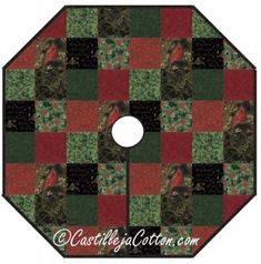 a red and green patchwork quilted design on a circular background with the words, christmas