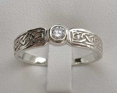 a white gold ring with two diamonds on it