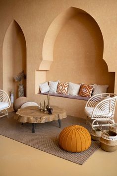 a living room filled with furniture and pillows