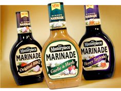 three bottles of marinade on a table