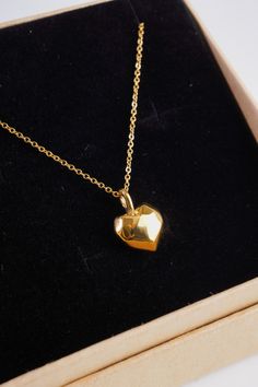 Add some love to your look with our Cherished Heart Necklace. Featuring an 18K gold plated chain and a unique geometric heart pendant. It is 18" long and has a 2" chain extender so you can adjust the length to your liking. This necklace is perfect for adding a touch of elegance to any outfit or could be the perfect gift for a special loved one. Pair with our cherished heart earrings! Gold Heart Necklace With Box Chain, Heart Pendant Necklace With Box Chain As Gift, Heart Pendant Necklace With Box Chain For Gift, Gold Heart Pendant Necklace With Box Chain, Gold Teardrop Pendant Necklace For Valentine's Day, Gold Plated Heart Necklace With Adjustable Chain As Gift, Gold Plated Heart Necklace With Adjustable Chain, Geometric Heart, Perfect Gif