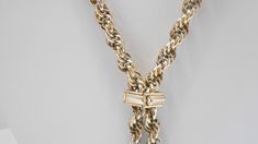 "Vintage gold tone 28\" lariat chain necklace. Intertwined chain links. Pullover necklace...no fastener. Four gold tone dangles. Necklace is adjustable with a square gold tone metal attachment. Classic necklace. Excellent condition. Unsigned." Formal Gold Chain Lariat Necklace, Formal Lariat Toggle Necklace With Chain, Formal Lariat Toggle Necklace, Vintage Gold Lariat Necklace With Adjustable Chain, Metal Lariat Necklace For Formal Occasions, Formal Metal Lariat Necklace, Funky Necklace, Classic Necklace, Chain Links