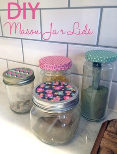 mason jar lids are lined up on the counter