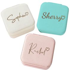 three small personalized jewelry cases in various colors and designs, one with the word sherp written on it