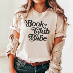 Let the world know you're a dedicated book club babe. Whether you're a die-hard fan of classic literature or a lover of contemporary fiction, this shirt is the perfect way to celebrate your love of reading. With its classic style, this t-shirt also makes a great gift for any book lover in your life. SIZING: ✧ Unisex sizing; slightly larger than typical women's shirts and slightly smaller than typical men's shirts. ✧ Most women find their typical size works best for a loose fit ✧ For an oversized look, size up Easy measuring tip: Take your favorite sweatshirt or tee, lay it on a flat surface and measure the width (armpit to armpit) and length (top to bottom), then compare with our size chart in the image section. CARE INSTRUCTIONS: -Machine wash, inside out on the gentle cycle. Lay flat to Babe T Shirt, Love Of Reading, Contemporary Fiction, Classic Literature, Any Book, Die Hard, Men's Shirts, Women's Shirts, Book Lover