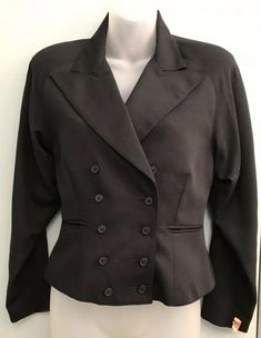 A very rare very cool retro blazer jacket by JR'S.  Black and fully lined.  It is a fitted style with two vertical seams in the front and back.  It has double rows of 5 buttons on front and 3 buttons on sleeves and two front lapel pockets.  Very cool and versatile. It would be great for work and casual occasions. It will become a favorite.  It is in very good vintage pre-owned  condition (see photos).  Armpit to Armpit:  Front Neck To Sleeve Hem 13.5" Length - Shoulder To Hem 24" Size - 5 Women' Vintage Black Blazer For Office, Vintage Tailored Black Blazer, Vintage Double-breasted Blazer, Vintage Black Double-breasted Blazer, Fitted Style, Breasted Blazer, Double Breasted Blazer, Very Rare, Double Breasted