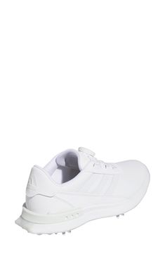 a white sneaker that is on top of a white shoe with the word adidas written