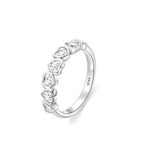 a white gold ring with four hearts on it