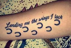 a person with a tattoo on their arm that says, lending me the wings i lack