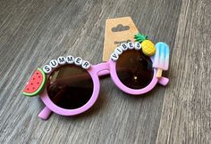 "Hand decorated children's sunglasses! This pair reads \"Summer Vibes\"." Cute Sunglasses With Uva Protection For Vacation, Fun Sunglasses With Gradient Lenses For Vacation, Fun Summer Sunglasses With Gradient Lenses, Cute Summer Sunglasses With Gradient Lenses, Fun Polarized Sunglasses For Vacation, Multicolor Sunglasses For Beach In Summer, Fun Sunglasses With Uva Protection For Vacation, Fun Sunglasses With Uv Protection For Vacation, Playful Sunglasses With Gradient Lenses For Summer