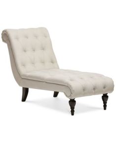 a white chaise lounge chair with black legs