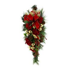 a christmas arrangement with pine cones, red flowers and bells on the top is shown