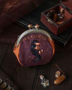 a small purse sitting on top of a wooden table