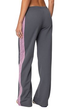 Sporty stripes trail the sides of these wide-leg cotton-blend sweatpants topped with a comfortable elasticized drawstring waist. Elastic/drawstring waist 50% cotton, 50% polyester Machine wash, dry flat Imported Full Length Athleisure Pants With Three Stripes, Athleisure Full-length Bottoms With Three Stripes, Athleisure Full Length Bottoms With Three Stripes, Cotton Sports Pants With Contrast Stripes, Jogging Sweatpants With Side Stripes, Wide Leg Cotton Pants With Three Stripes, Athleisure Bottoms With Contrast Stripes, Sports Wide Leg Pants With Contrast Stripes, Casual Wide Leg Sweatpants With Three Stripes