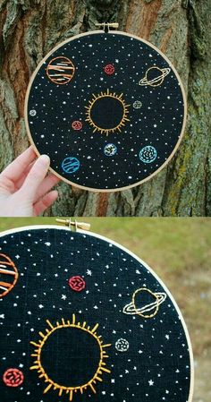 an embroidery project with planets and sun on it