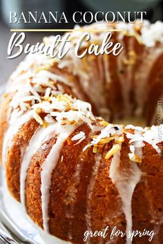 a bundt cake with white icing and sprinkles on top sitting on a plate