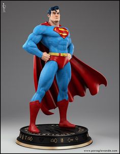 the superman statue is on display in front of a gray background