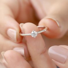 Our Tiny Kristian Moissanite Ring is the perfect stacking ring to add to your collection! It's perfect for everyday wear. Wear it by itself for a minimal look, or stack it with your other favorites. Details: Center stone Gemstone: Moissanite Stone Shape: Round Measurements: 4.00mm Band measurements: approx. 1.8mm wide, approx. 1.5mm thick The Kristian ring is also available in solid gold. Contact us for pricing. The Kristian ring is also available in other gemstones. Minimalist Open Diamond Ring In Diamond White, Minimalist Diamond White Open Diamond Ring, Minimalist Diamond Ring With Brilliant Cut, Minimalist Diamond White Diamond Ring As Gift, Minimalist Diamond White Crystal Promise Ring, Minimalist Diamond White Ring As Gift, Minimalist Stackable Round Cut Diamond Ring, Classic Diamond Crystal Ring For Everyday, Solitaire Stackable Rings For Promise