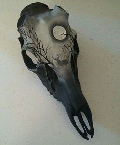 an image of a fake animal skull with trees on it