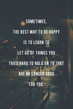 a city street at night with the words sometimes, the best way to be happy is to learn to let go of things you tried hard to hold on that are no longer good for you
