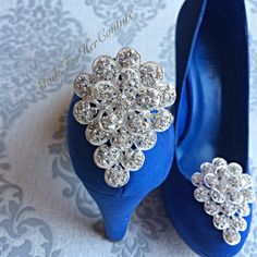 Shoe clips, wedding shoe clips, shoe clip ons, shoe clips bridal, wedding flower shoe clips, bridal shoe clips, pearl shoe clips, accessory Was: $58 Now: $44 USE CODE: MADE10 for 10% off multiple orders and orders over $50 U.S. A pair of beautiful shoe clips perfect to accessorize any shoes. Designed for brides but can also be used for any other occasion. The clips are easy to open and adorn a pair of shoes. The embellishment is approximately 1.8 inches wide and 2.5 inches long each. Please read Pearl Shoe, Flower Wedding Shoes, Shoe Clips Wedding, Bridal Shoe, Pearl Shoes, Flower Shoes, Womens Pumps, Bridal Garter, Shoe Clips