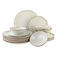 a stack of white plates and bowls on top of each other