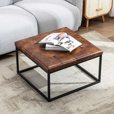 a coffee table with a magazine on it