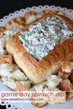 a white plate topped with bread and blue cheese on top of other food items next to each other