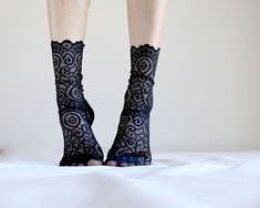 - Handmade with beautiful ornamental lace with scalloped edge and black mesh fabric. - Soft, comfortable and look so pretty on! - Sewn with uniquely created pattern to fit your feet best - Come in 3 sizes: Small, Medium, Large SMALL fits: US: 6 - 7.5, EU: 35.5 - 37.5, UK: 4 - 5.5 MEDIUM fits: US: 8 - 9.5, EU: 38 - 40.5, UK: 5.5 - 7 LARGE fits US: 10 - 12.5, EU: 42 - 45, UK: 8 -10.5 Fiber Content: - 90% Nylon, 10% Spandex Care Instructions: - Hand wash or Machine gentle cycle wash cold - Air Dry Black Lace Socks, Camp Socks, Womens Socks, Mesh Socks, Cotton Bralette, Lace Socks, Burgundy Lace, Girls Socks, Fancy Outfits