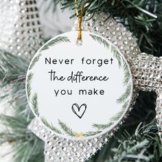 a christmas ornament that says never forget the differences you make on a tree