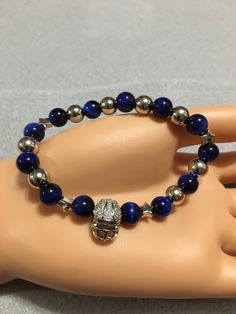 DALLAS Cowboys, Dallas Helmet CHARM, Sports BRACELET, Football girlfriend, Tigers Eye Bracelet, Blue and Steel Dallas Charm Bracelet #FootballGirlfriend #NflBracelet #GoodLuckBracelet #DallasCowboys #DallasCowboysGift #SportsBracelet #TigerEyeStone #NflJewelry #TigersEyeBracelet #DallasHelmetCharm Nfl Jewelry, Blue Tiger Eye Bracelet, Tigers Eye Bracelet, Football Bracelet, Small Birthday Gifts, Good Luck Bracelet, Sports Bracelet, Blue Tigers, Tiger Eye Bracelet