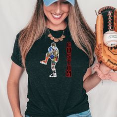 a woman wearing a baseball glove and t - shirt with the word custom printed on it