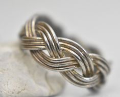 "Rope ring braided pinky band sterling silver women girls Size 5.25 Weight 3.7g Band width 1/4\" Free Domestic Shipping and Free Postal Insurance Delivered in a gift Box If you do not want the ring polished and want to leave the natural patina please let me know at the time of purchase as I do polish rings before I ship rings out. Thanks USPS Domestic Shipping is free for buyers. If a buyer prefers to upgrade to priority, the buyer will pay that portion of the shipping charge. If the actual cost Silver Sterling Braided Bracelets, Sterling Silver Braided Silver Jewelry, Sterling Silver Braided Jewelry In Silver, Braided Sterling Silver Jewelry, Adjustable Jewelry With Interwoven Design For Gifts, Adjustable Stackable Silver Bands, Adjustable Sterling Silver Band Jewelry, Sterling Silver Jewelry With Interwoven Design For Gift, Adjustable Silver Braided Jewelry