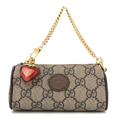 This is an authentic GUCCI GG Supreme Monogram Strawberry Retro Interlocking G Barrel Coin Purse in Beige, Ebony. This stylish mini bag is crafted of Gucci GG supreme monogram coated canvas, with a brown leather trim. It features a polished gold chain strap with a clasp at the end and a strawberry zipper that opens to a compact beige microfiber interior. Gucci Strawberry Bag, Gg Marmont Mini Bag, Gucci Mini Bag, Gucci Coat, Gucci Purse, Swag Bag, Monogram Bag, Perfect Pink, Bag Light