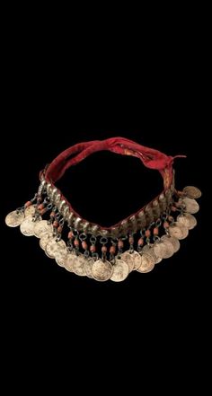 This exquisite necklace choker is a genuine antique piece from the 1880s and features a silver Ottoman monogram coin. The necklace is handmade with great attention to detail and the choker style adds elegance to any outfit. The type of necklace/locket is a classic coin design and the main stone is a beautiful coral in silver color. This piece is perfect for antique jewelry enthusiasts who appreciate the art and history of jewelry making. The items I sell are not new, they are vintage or antiques Vintage Coin Necklaces For Festival, Vintage Medallion Jewelry For Festival, Vintage Medallion Jewelry For Festivals, Vintage Festival Medallion Jewelry, Silver Vintage Charm Necklace For Festival, Vintage Round Pendant Jewelry For Festivals, Silver Necklace With Vintage Charm For Festival, Silver Jewelry With Vintage Charm For Festivals, Traditional Necklace With Coin Pendant