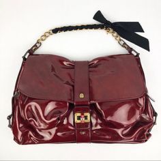 Medium To Large Size Lanvin Shoulder Bag. Maroon With Gold Hardware And Black Ribbon. Excellent Condition. Never Used. Still Has Tags. Evening Burgundy Satchel With Gold-tone Hardware, Red Formal Bag With Fold Over Clasp, Formal Red Bag With Fold Over Clasp, Evening Satchel With Detachable Strap In Burgundy, Chic Red Satchel With Magnetic Closure, Evening Burgundy Satchel With Detachable Strap, Designer Burgundy Satchel For Evening, Lanvin Bag, Black Ribbon