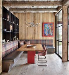 a wooden table sitting next to a long bench