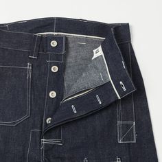 This unique denim pant is cut from a comfortable mid-weight raw denim, which has been left raw to shrink up to 8% in the first wash. A wide straight leg has added to this design, which offers a brilliant vintage silhouette, while a high rise and large patch back pockets add to the relaxed fir of this model. When it comes to detail, John Gluckow is something of a stickler for intricacy, exemplified here by a selvedge waistband, a selvedge button-fly plate, selvedge belt loops, and a wraparound le Porter Yoshida, Denim Pocket, Vintage Silhouette, Selvedge Denim, Raw Denim, Vintage Inspired Design, Clothing Co, Denim Pant, Denim Wash