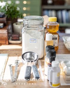 the jars are filled with different types of medicine and other medical supplies on a table