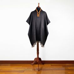 This is a handmade unisex poncho, made of alpaca wool yarn. It is light although is warm, very soft to touch and won't itch. One Size (approx.): 46" x 43" / 116 cm W x 108 cm H incl. fringe Material: Alpaca Wool blend Colour/pattern could vary slightly from the photo. Weight of each item (approx.): 750 g / 1.65 lbs Care: Hand Wash Use Mild Detergent Do not Bleach Alpaca Brown Shawl For Winter, Brown Alpaca Shawl For Winter, Black Alpaca Poncho For Winter, Brown Alpaca Poncho For Winter, Handwoven Brown Poncho For Winter, Black Alpaca Cape For Winter, Winter Brown Alpaca Shawl, Cozy Brown Wool Poncho, Luxury Alpaca Poncho One Size