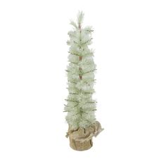 a small white christmas tree in a pot