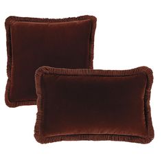 two brown velvet pillows with ruffled edges