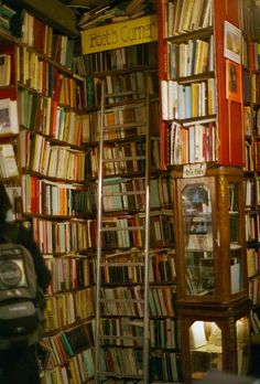 a room filled with lots of books on shelves