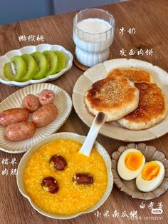 a table topped with plates and bowls filled with food next to each other on top of a wooden table